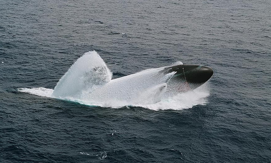 SURFACING — A US nuclear-powered submarine breaches the surface in a demonstration of how fast it can come up from the depths.