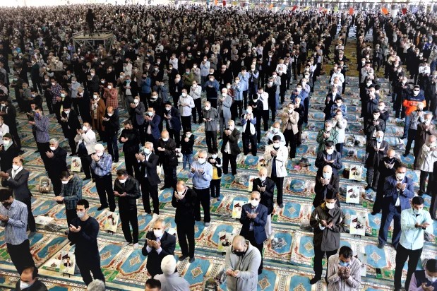 SPREAD OUT — Worshippers have returned to Friday prayers, but are required to social distance, unlike before.