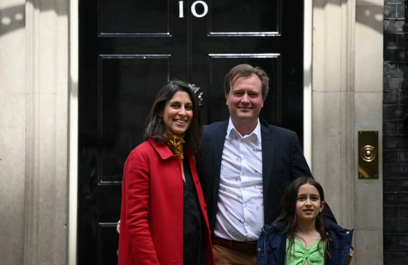 CLASSIC — Nazanin Zaghari-Ratcliffe, her husband and daughter pose for the claasic British photo in front of the door of the prime minister’s residence at #10 Downing Street. The family had just met with the prime minister