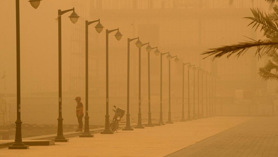 BROWNOUT — This cyclist in Abadan couldn’t see much in this sandstorm