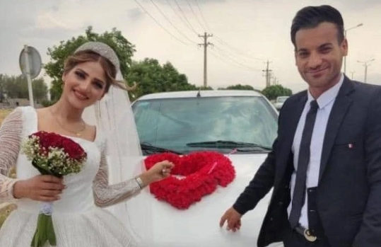 MARKED DAY — The bride and groom pose happily just moments before she was shot to death.