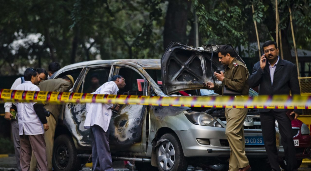 ONE SUCCESS — Delhi police check out a car bombed by a presumed Iranian operative in 2012. The one terror success the Pasdar could claim, it injured the wife of Israel’s military attache in India.