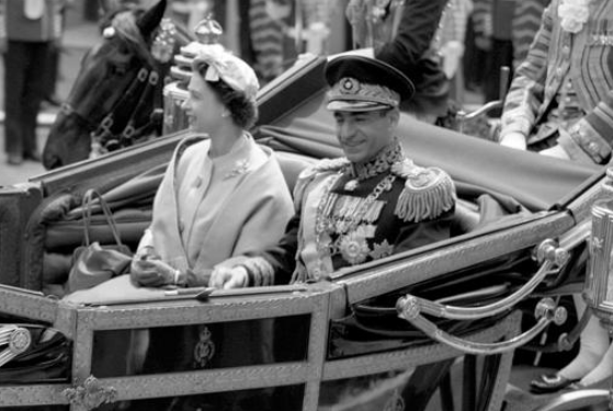 THE OLDE DAYS — The Shah rides with Queen Elizabeth in one of his state visits to Great Britain.